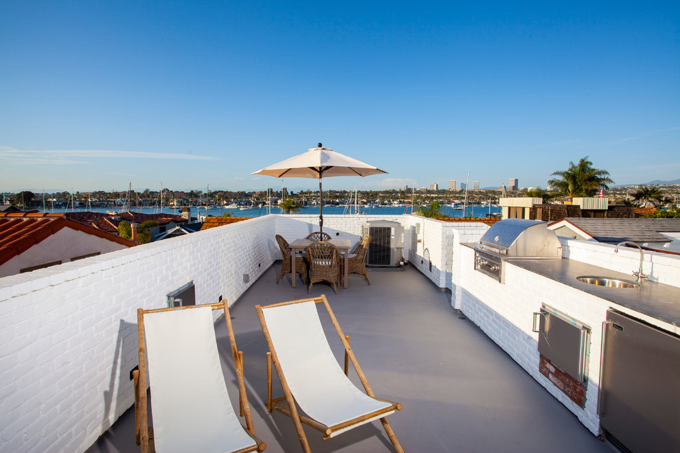 This is an example of a coastal roof terrace in Orange County with a roof extension.
