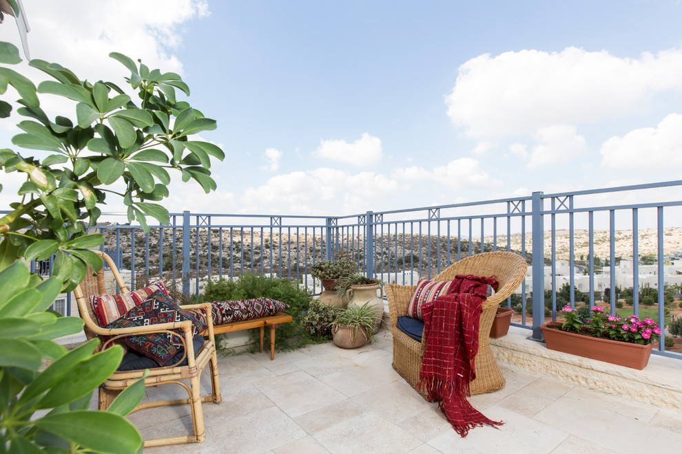 This is an example of a mediterranean roof rooftop terrace in Other with a potted garden.
