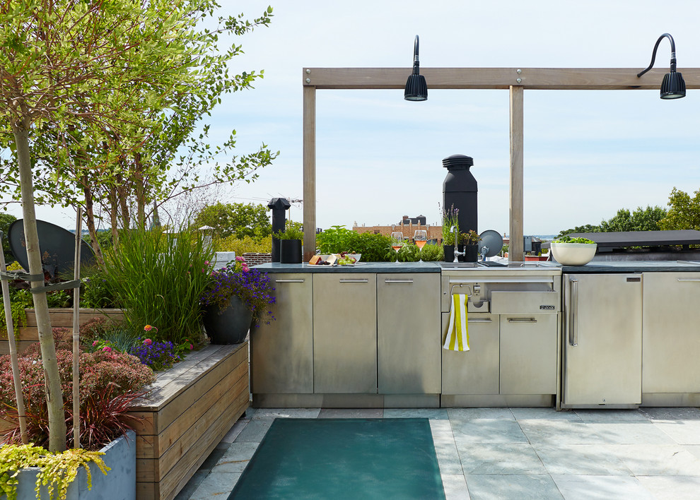 Inspiration for a huge contemporary rooftop outdoor kitchen deck remodel in New York with a pergola