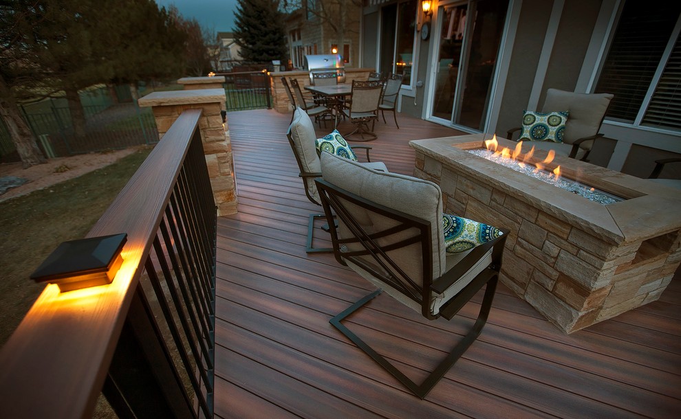 Deck - traditional backyard deck idea in Denver with a fire pit