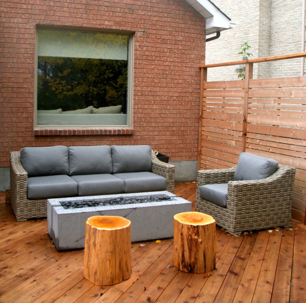 Design ideas for a large modern back terrace in Ottawa with a fire feature and no cover.