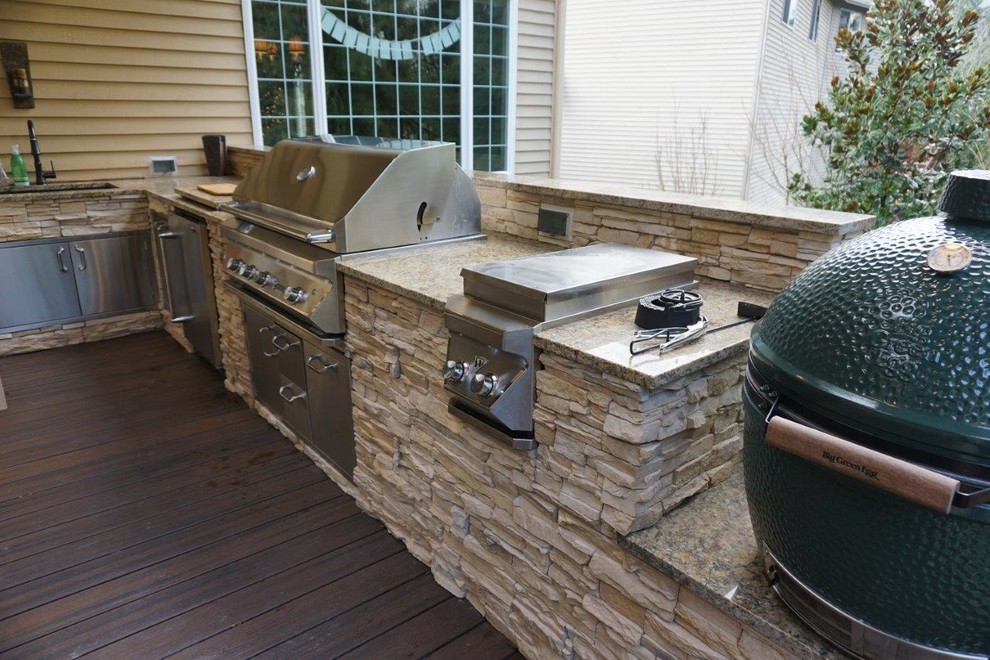 Outdoor kitchen deck - mid-sized contemporary backyard outdoor kitchen deck idea in Seattle with a roof extension