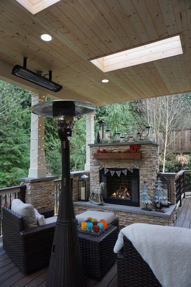 Design ideas for a medium sized contemporary back terrace in Seattle with a fire feature and a roof extension.