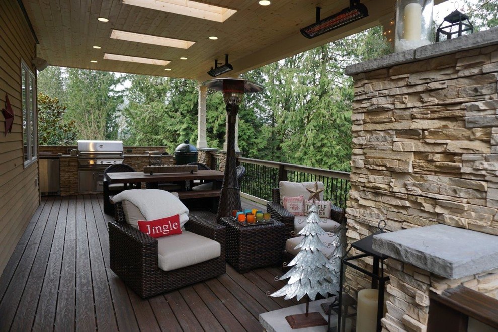 Example of a mid-sized trendy backyard outdoor kitchen deck design in Seattle with a roof extension