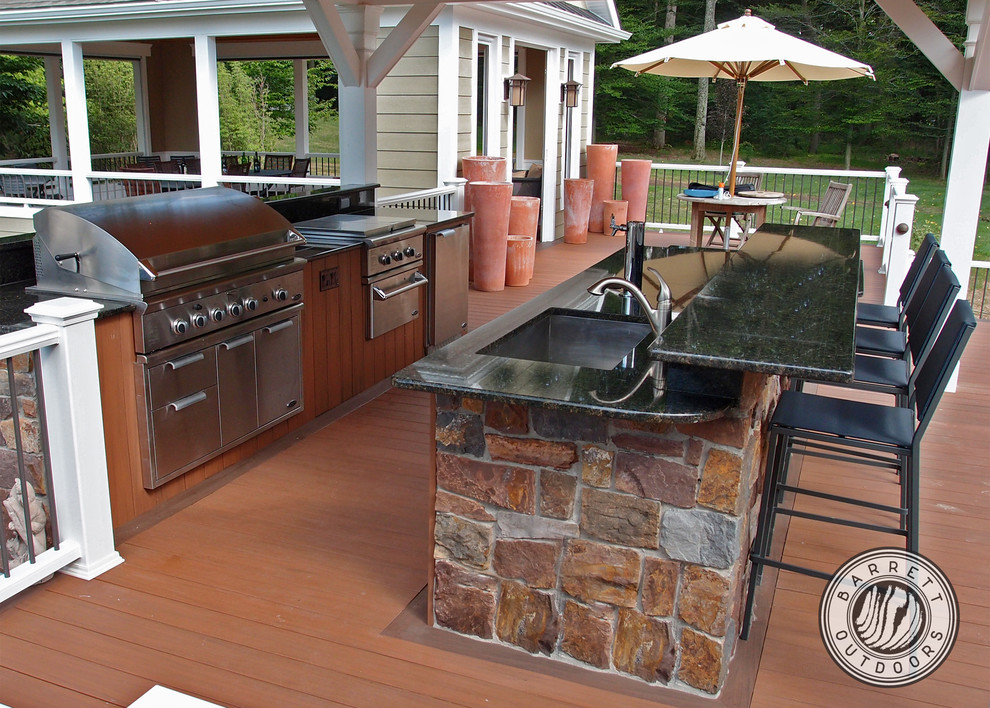 Design ideas for a classic back terrace in New York with an outdoor kitchen.