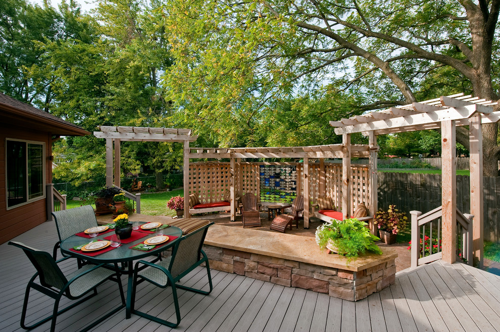 Photo of a traditional back terrace in New Orleans with a pergola.