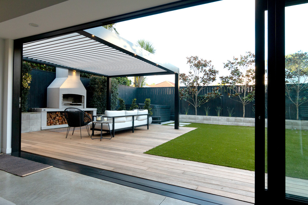 Inspiration for an expansive contemporary back terrace in Auckland with an outdoor kitchen and a roof extension.
