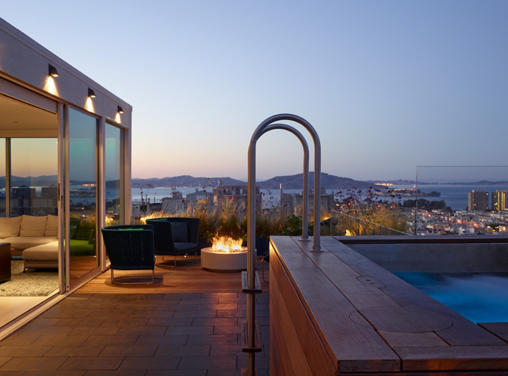 Design ideas for a large contemporary roof terrace in San Francisco with a fire feature and no cover.