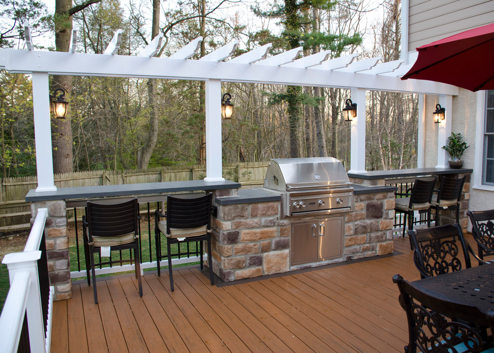Inspiration for a large classic back terrace in Philadelphia with an outdoor kitchen, feature lighting and a pergola.