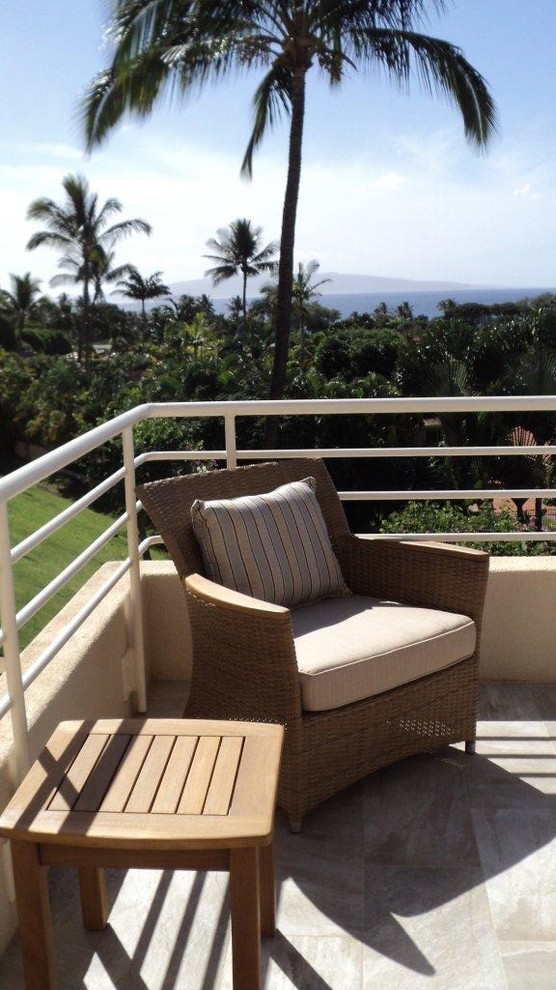 Medium sized world-inspired back terrace in Hawaii with a water feature and no cover.