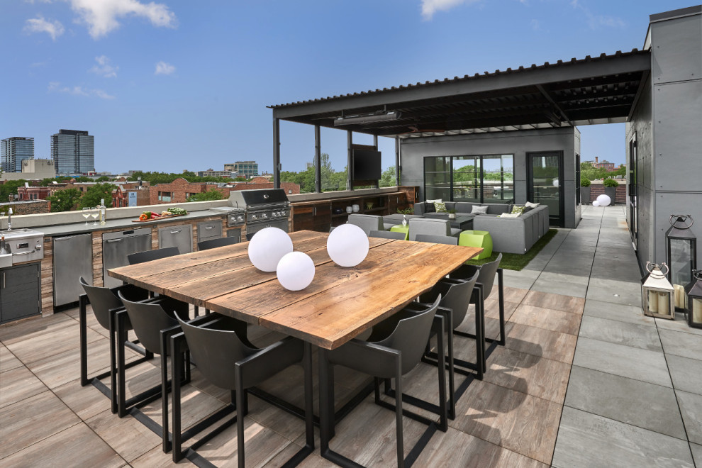 Réalisation d'une terrasse sur le toit design avec une cuisine d'été.