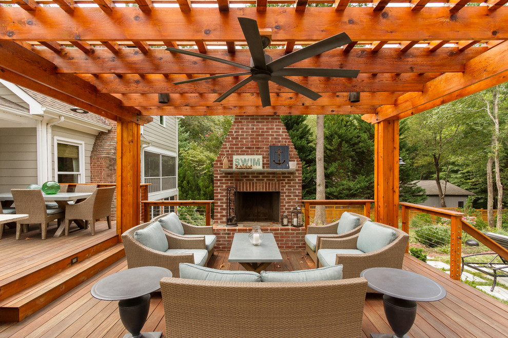 Inspiration for a medium sized classic back terrace in Charlotte with a fire feature and a pergola.