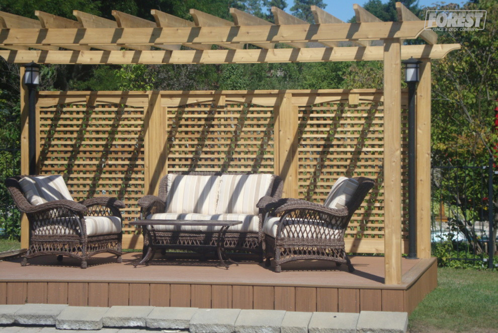 Inspiration for a medium sized traditional back terrace in Toronto with a pergola.