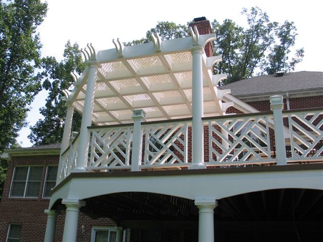 Inspiration for a large traditional back terrace in DC Metro with a pergola.