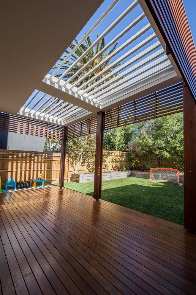 Deck - mid-sized contemporary backyard deck idea in Melbourne with a pergola