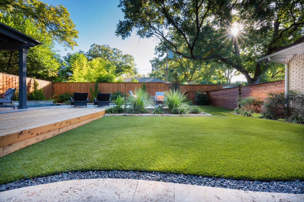 Inspiration for a mid-sized contemporary backyard deck remodel in Dallas with a pergola