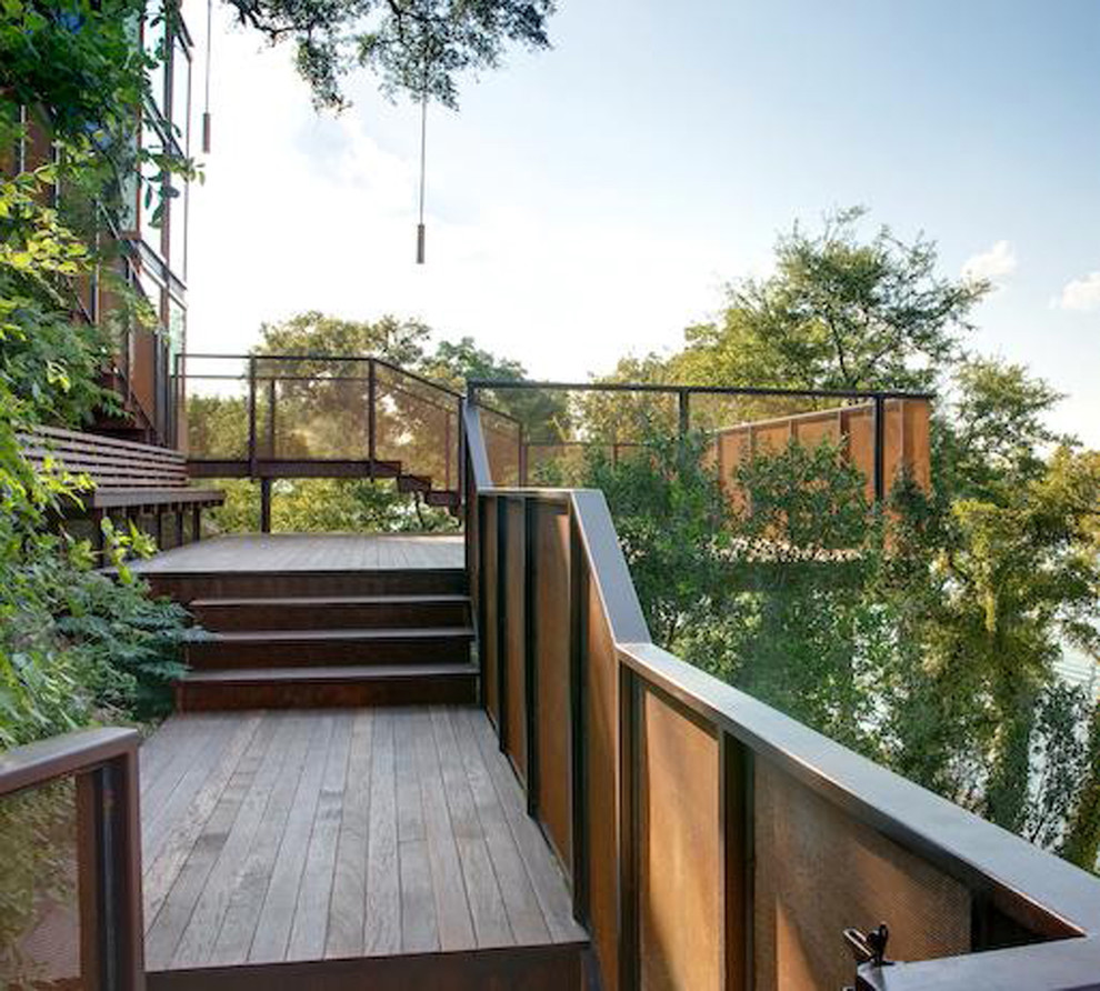 Inspiration for a large modern backyard deck remodel in Austin with no cover