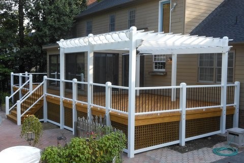Inspiration for a mid-sized transitional backyard deck remodel in Richmond with a pergola