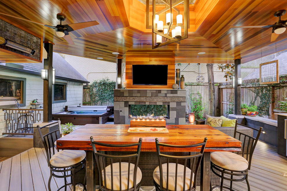 Design ideas for an expansive contemporary back terrace in Houston with an outdoor kitchen and a roof extension.