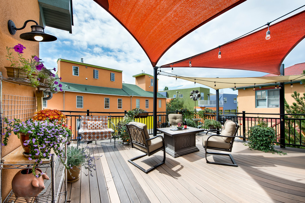 Deck - small transitional rooftop deck idea in Denver with an awning