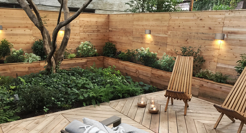 Design ideas for a medium sized contemporary back terrace in New York with a potted garden.