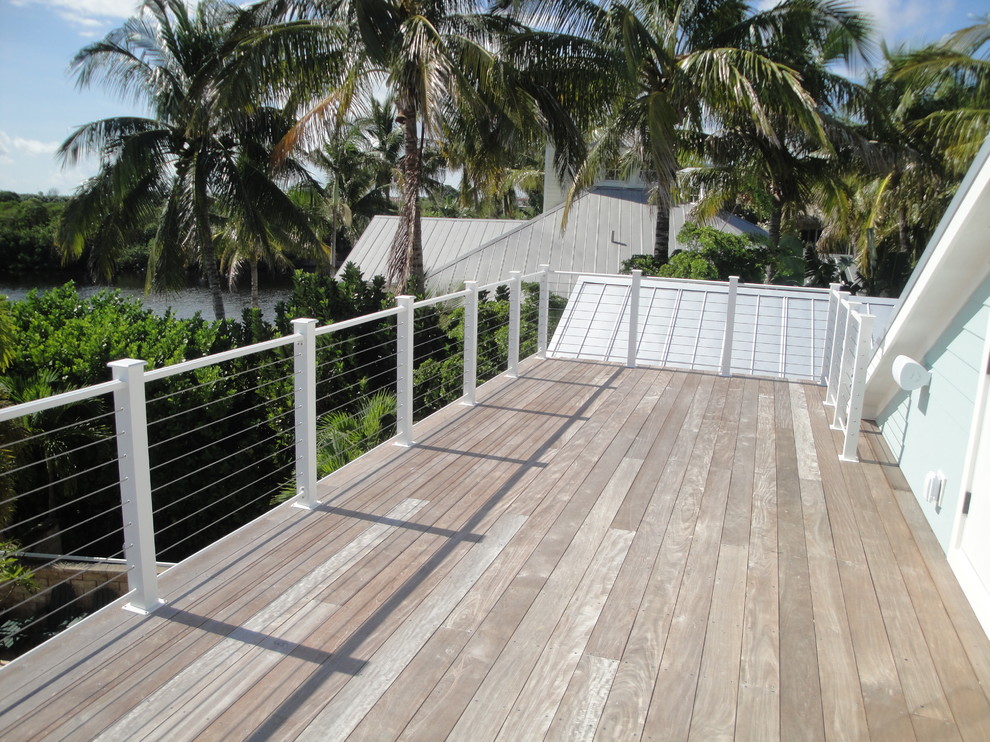 Large beach style rooftop deck photo in Miami with no cover