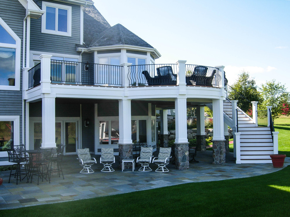 Example of a large classic backyard deck design in Minneapolis with no cover