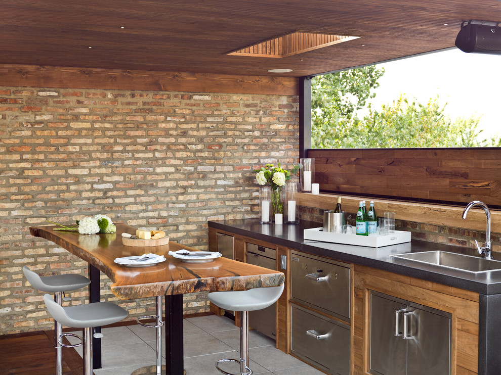 This is an example of a medium sized contemporary roof rooftop terrace in Chicago with an outdoor kitchen and a roof extension.