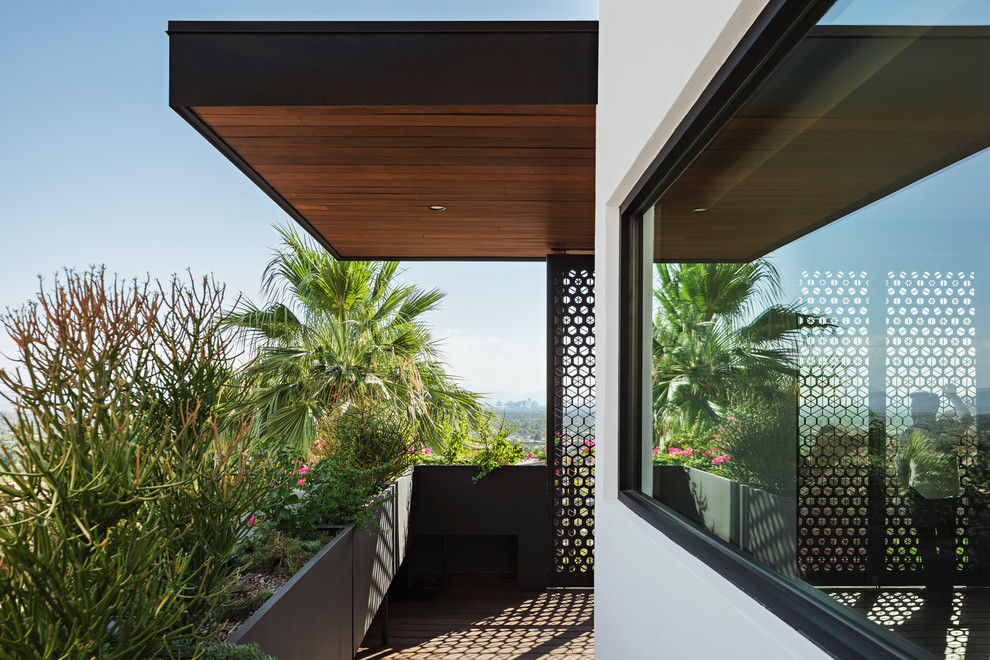Diseño de terraza minimalista en anexo de casas