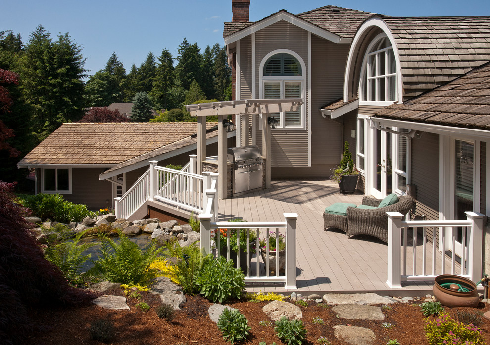 Outdoor kitchen deck - mid-sized traditional backyard outdoor kitchen deck idea in Seattle with no cover