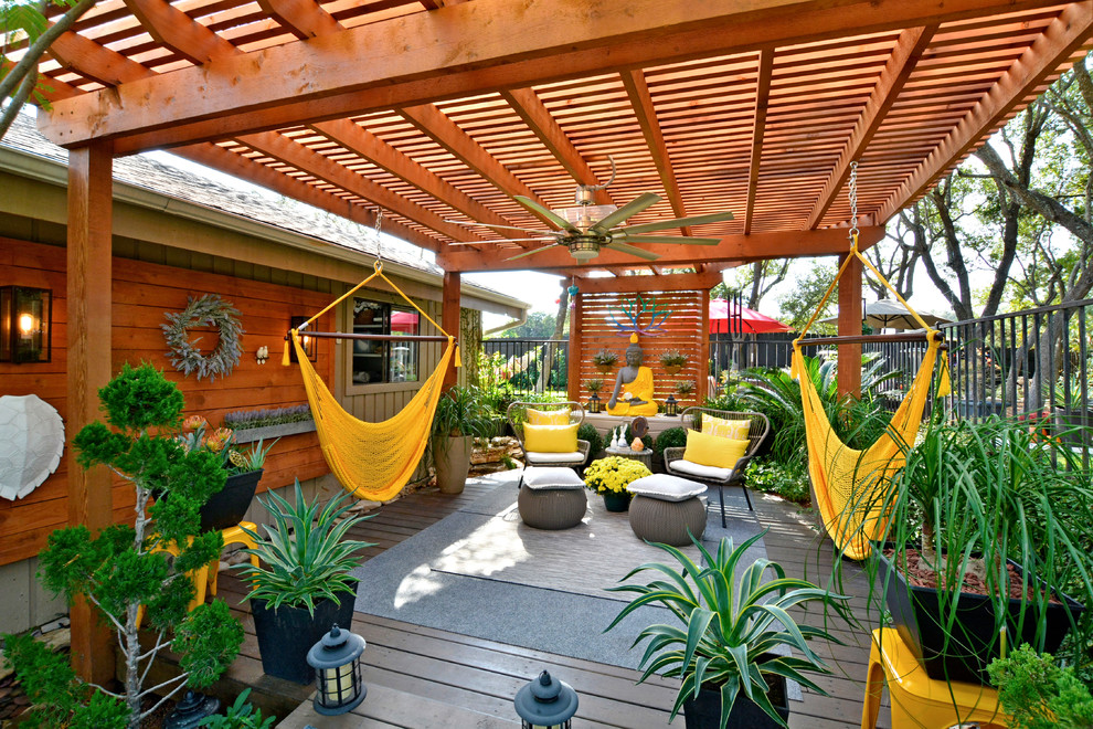 Deck container garden - large asian backyard deck container garden idea in Austin with a pergola