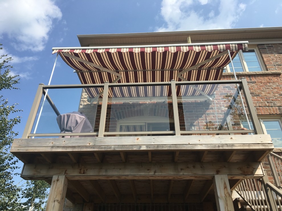 Retractable awning on 2nd level deck with Support Posts Traditional