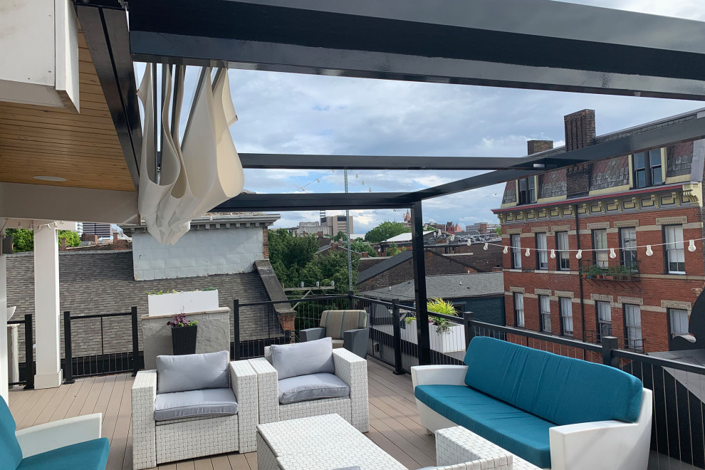 Example of a minimalist rooftop rooftop privacy and metal railing deck design in Cincinnati with a pergola