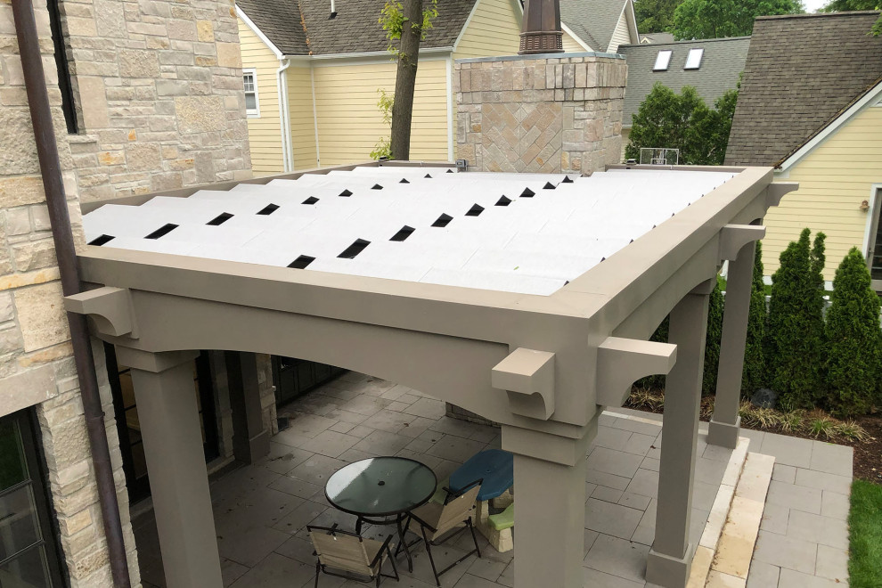 Inspiration for a contemporary side yard outdoor kitchen deck remodel in Detroit with a pergola