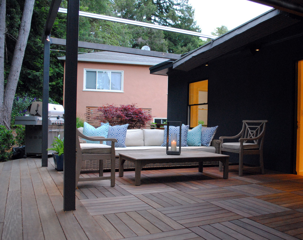 This is an example of a medium sized modern back terrace in San Francisco with an awning.