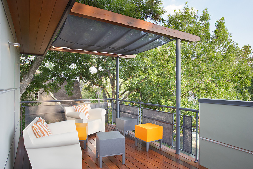 Design ideas for a medium sized modern terrace in Austin with an awning.