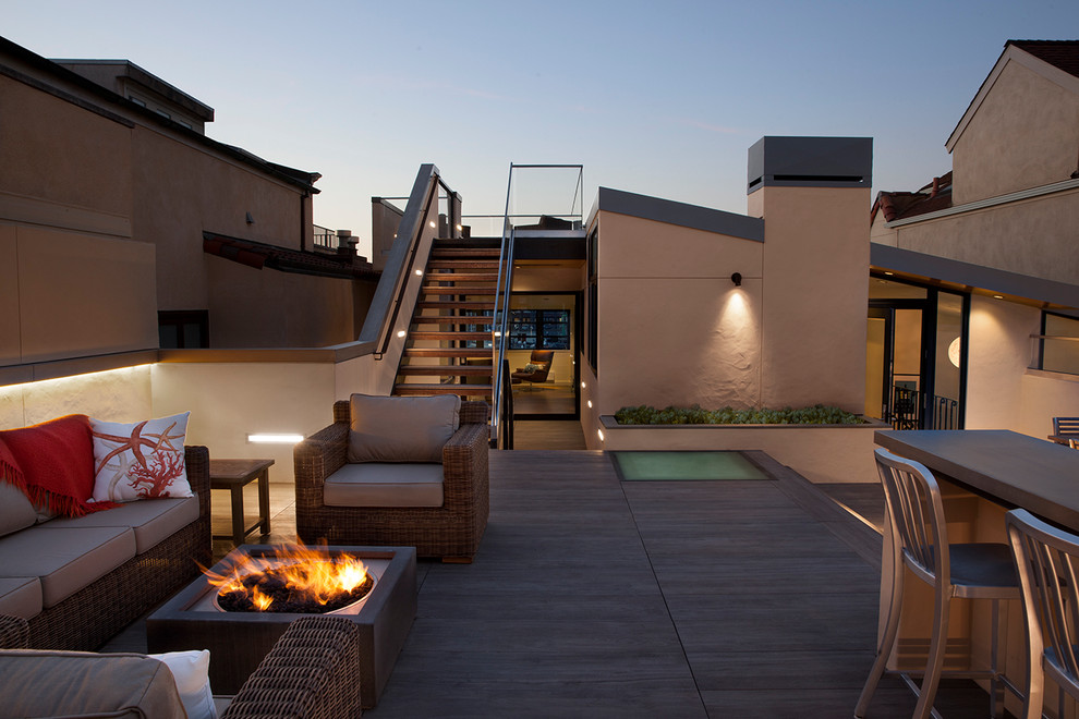 Photo of a large contemporary roof terrace in San Francisco with no cover and a fire feature.
