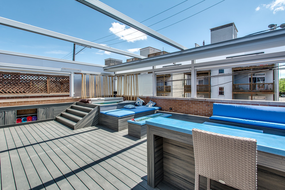 Inspiration for an expansive modern roof terrace in Chicago with a water feature and a pergola.