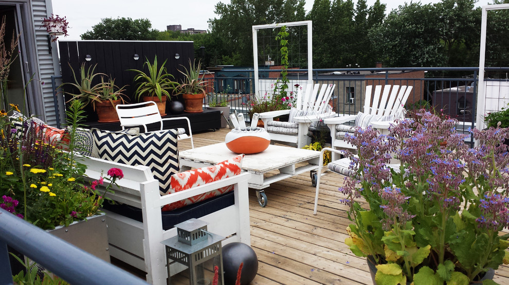 Example of a small trendy rooftop deck container garden design in Montreal with no cover