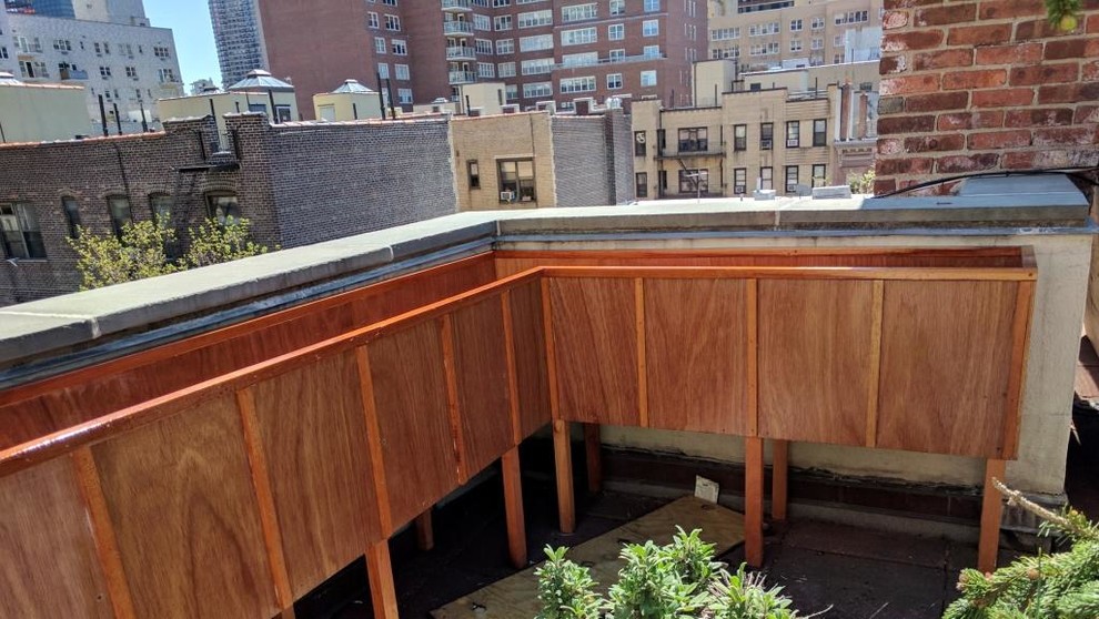 Design ideas for a medium sized traditional roof terrace in New York with a potted garden and no cover.