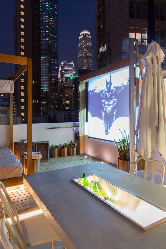 Deck - mid-sized industrial rooftop deck idea in Other with a pergola