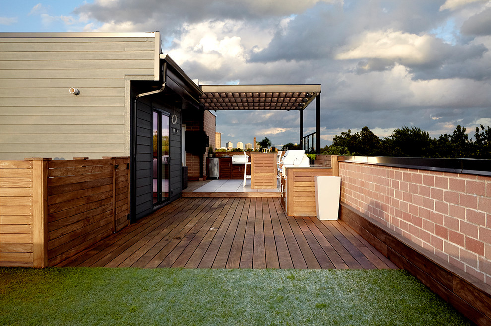 Large contemporary roof terrace in Chicago with an outdoor kitchen and a pergola.