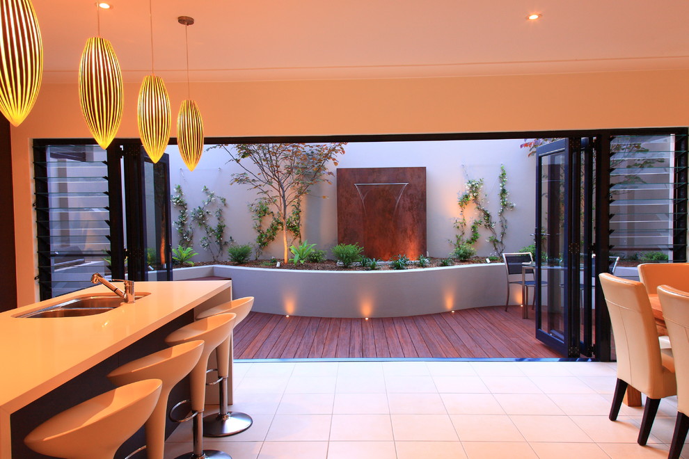 This is an example of a contemporary terrace in Sydney with a water feature.