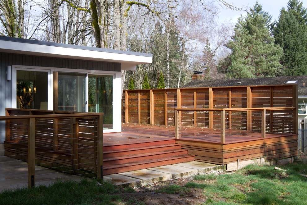 Inspiration for a 1960s deck remodel in Portland with a roof extension