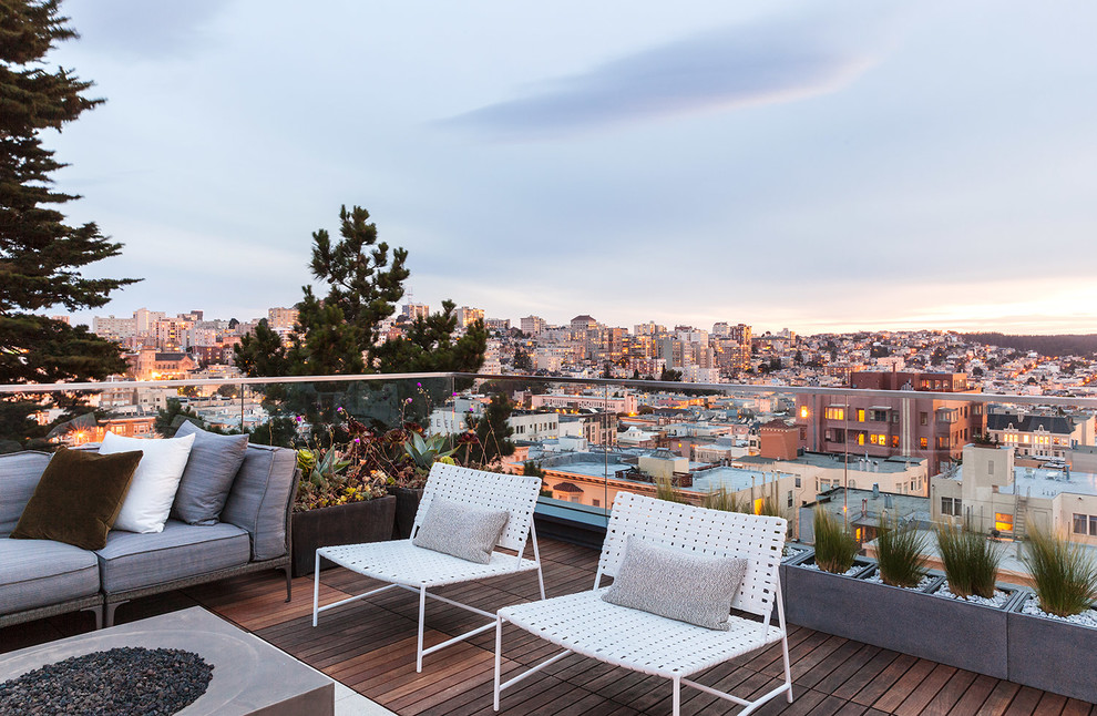 This is an example of a contemporary roof rooftop terrace in San Francisco with a fire feature and no cover.
