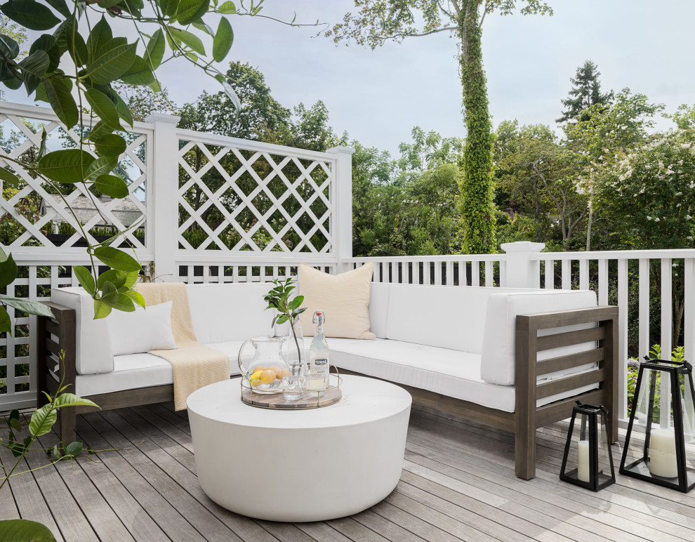 Example of a beach style deck design in New York with no cover