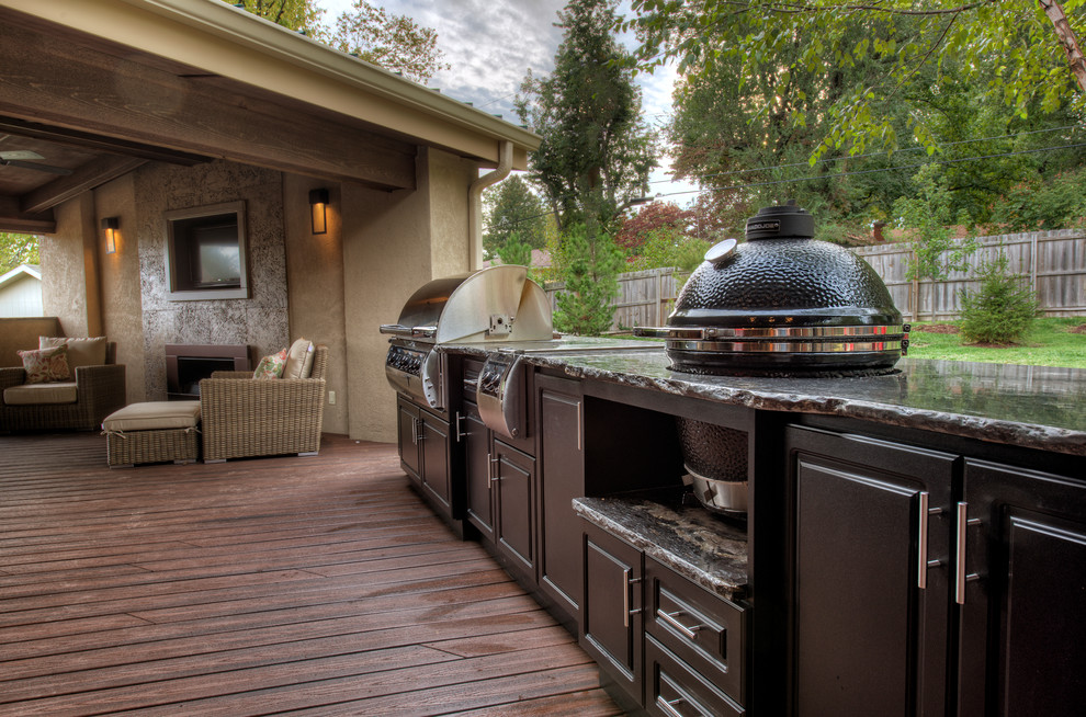 Inspiration for a large timeless backyard outdoor kitchen deck remodel in Other with a roof extension