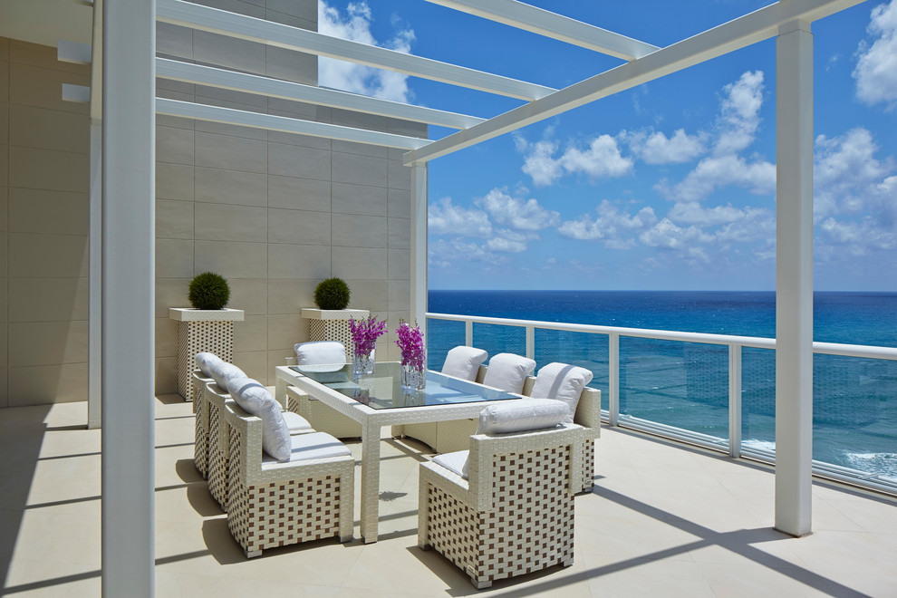 Photo of a contemporary terrace in Miami with a pergola.