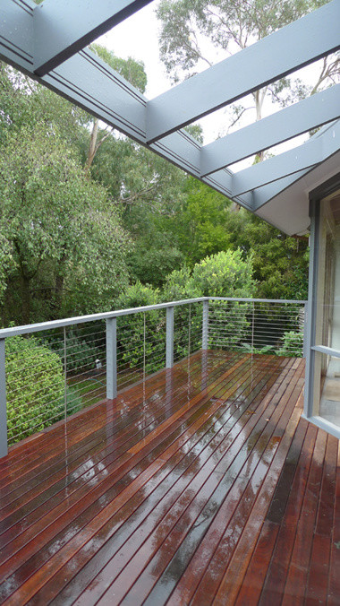 This is an example of a medium sized nautical terrace in Melbourne with a pergola.