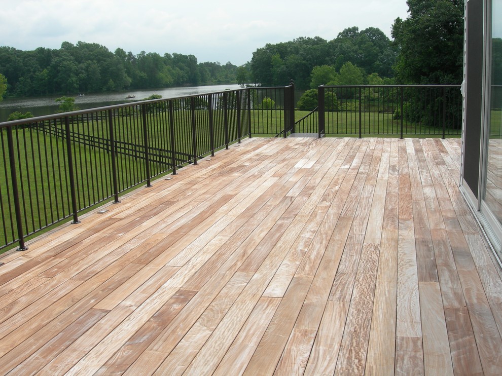 Huge transitional backyard deck photo in Other